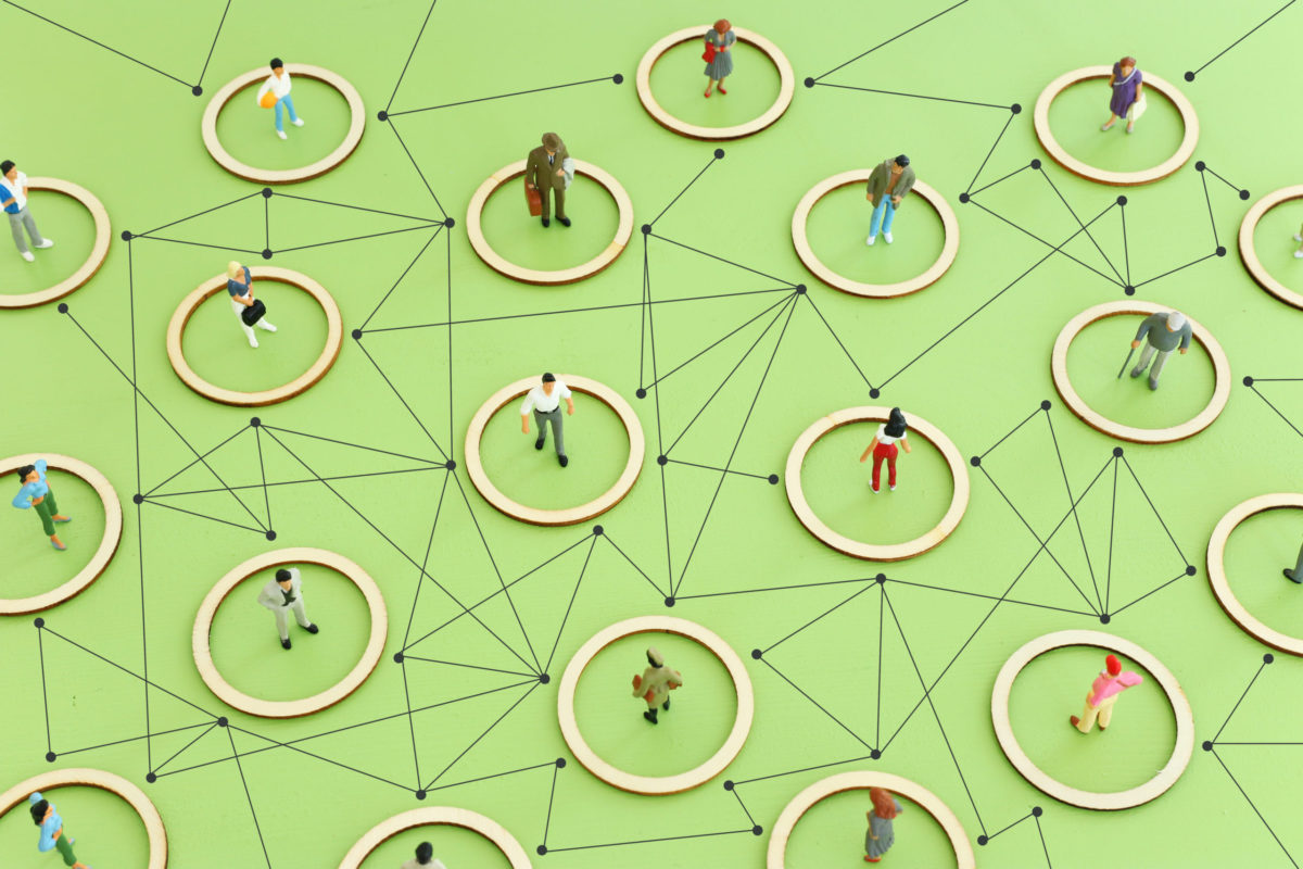 Business concept image of people figures over wooden table, human resources and management concept